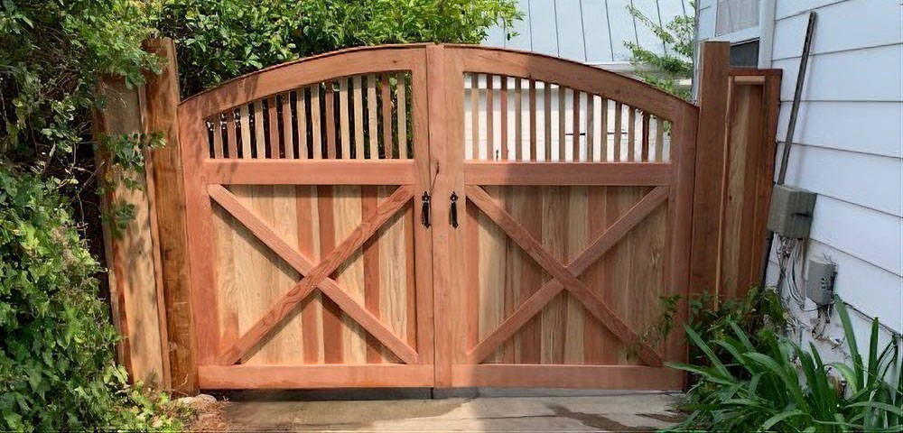 Wide double wood gates by Meza's Fence