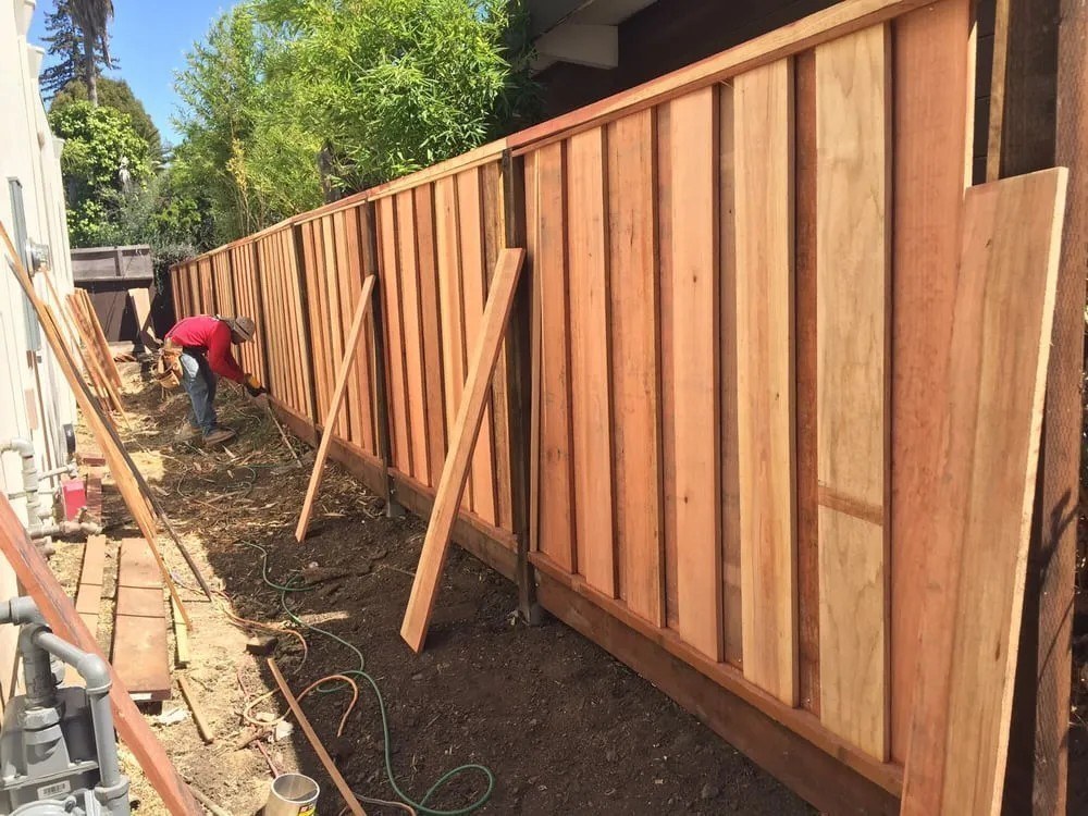 Meza's Fence crew replacing a wood fence line