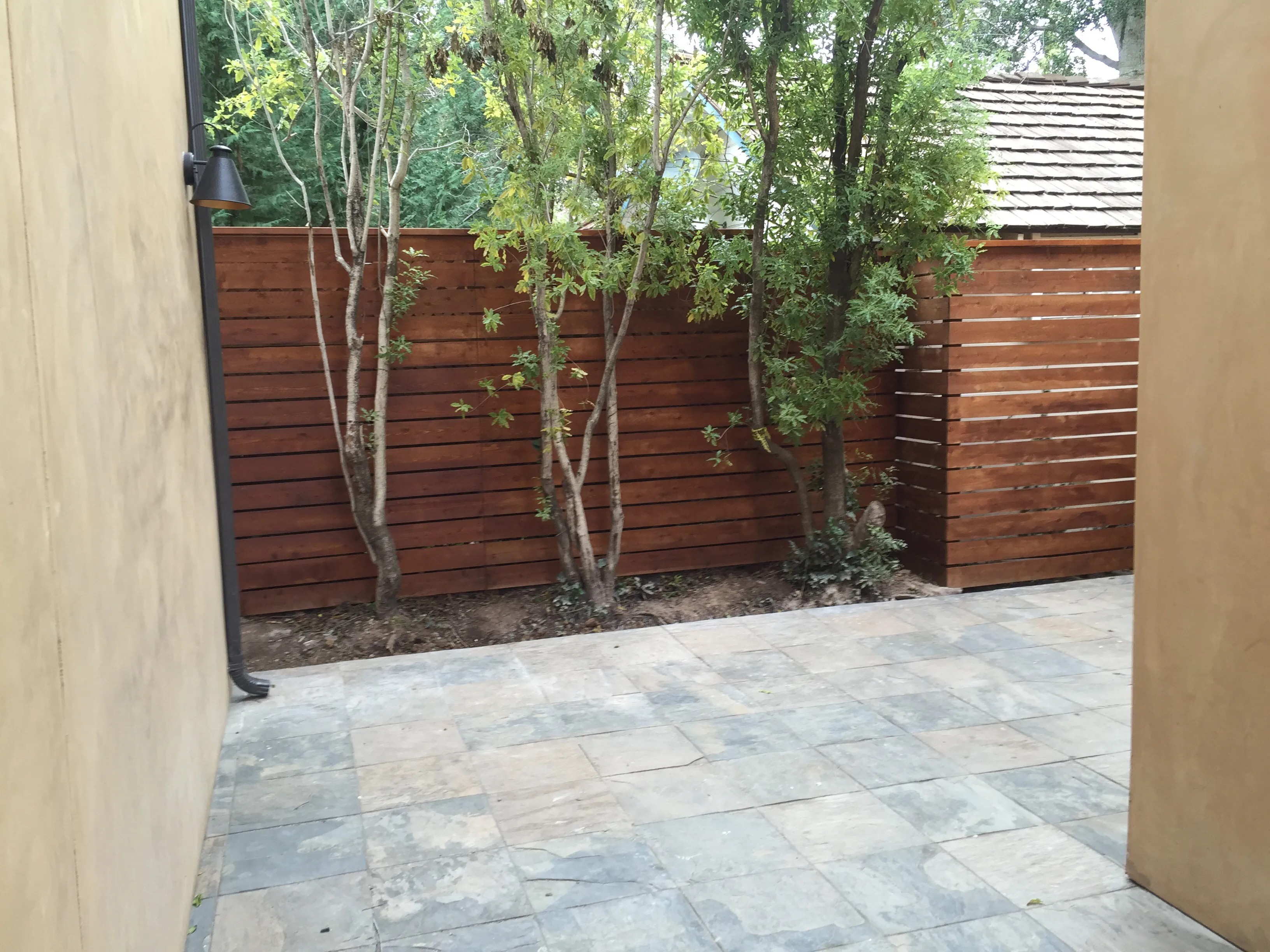 Stained horizontal good neighbor fence built by Meza's Fence